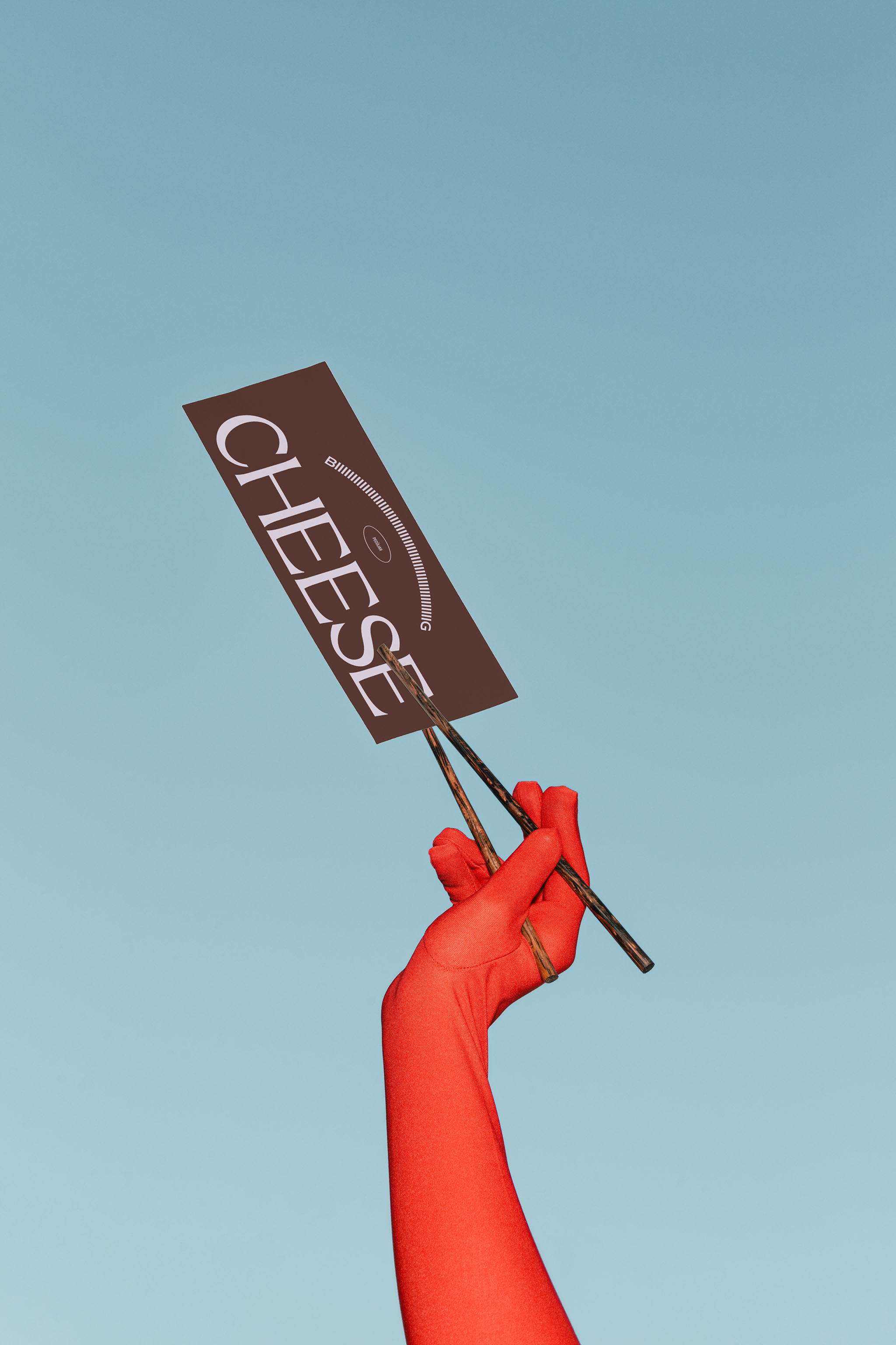 Photo of a red gloved hand, set against a light pastel blue sky, holding up a vertical paper menu with black typography with dark wooden chopsticks, in use example alternative colors.