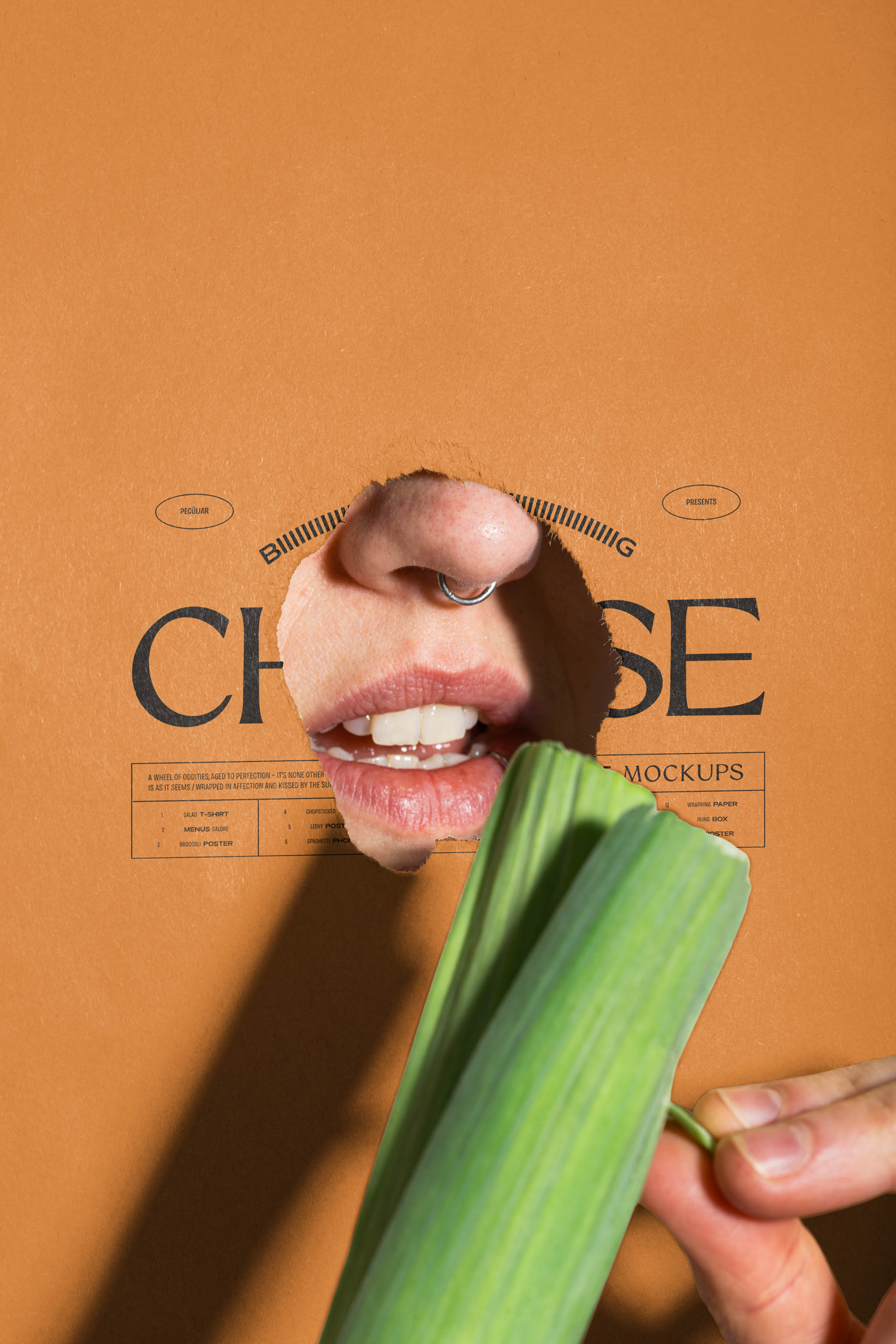 Close-up photo of a torn poster mockup with black typographic print placed on top of a person's mouth while they're peeling a raw leek, in use example alternative colors.