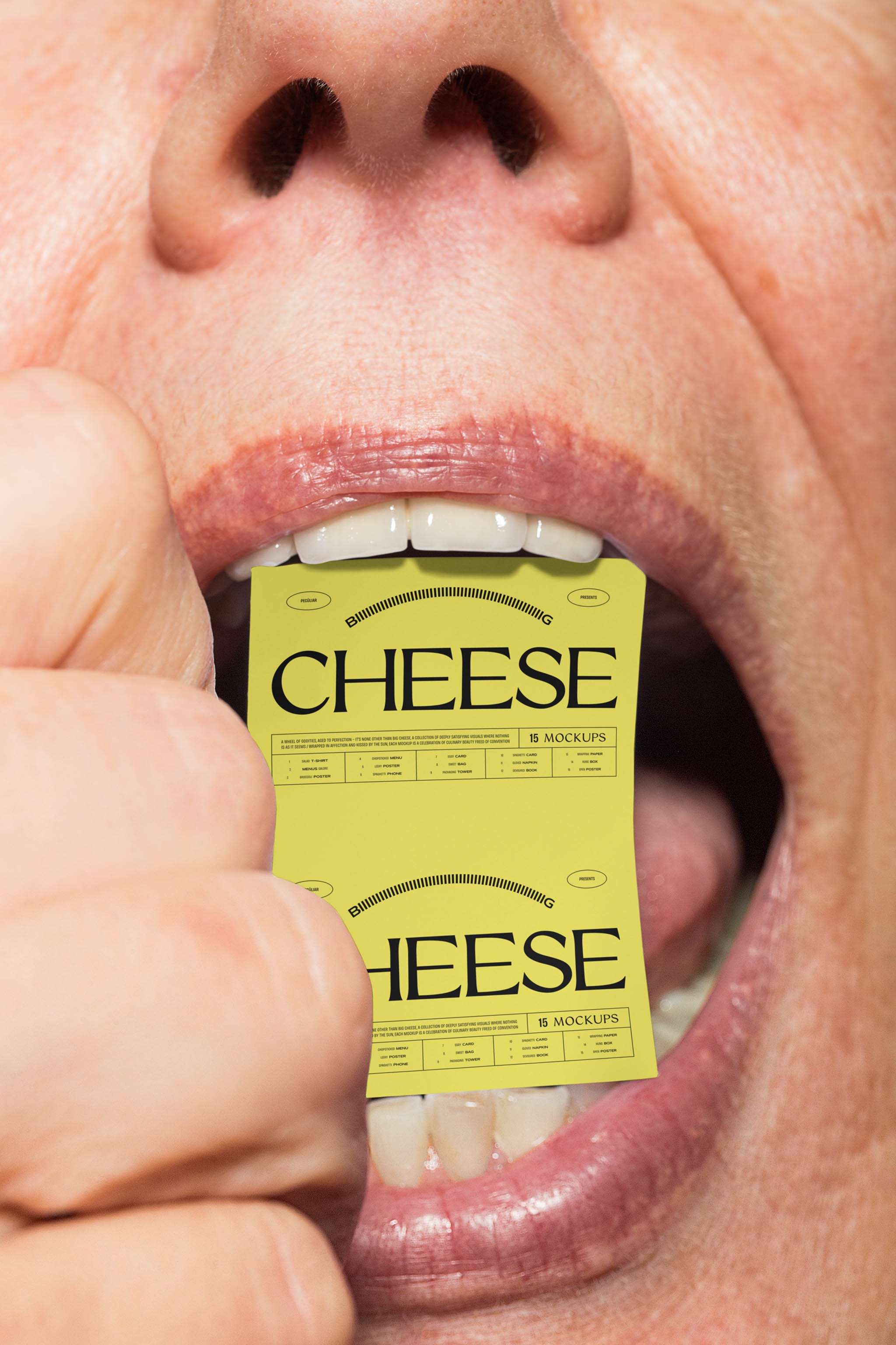 Close-up photo of a large open mouth holding a yellow typographic poster mockup with black lettering design, in use example.