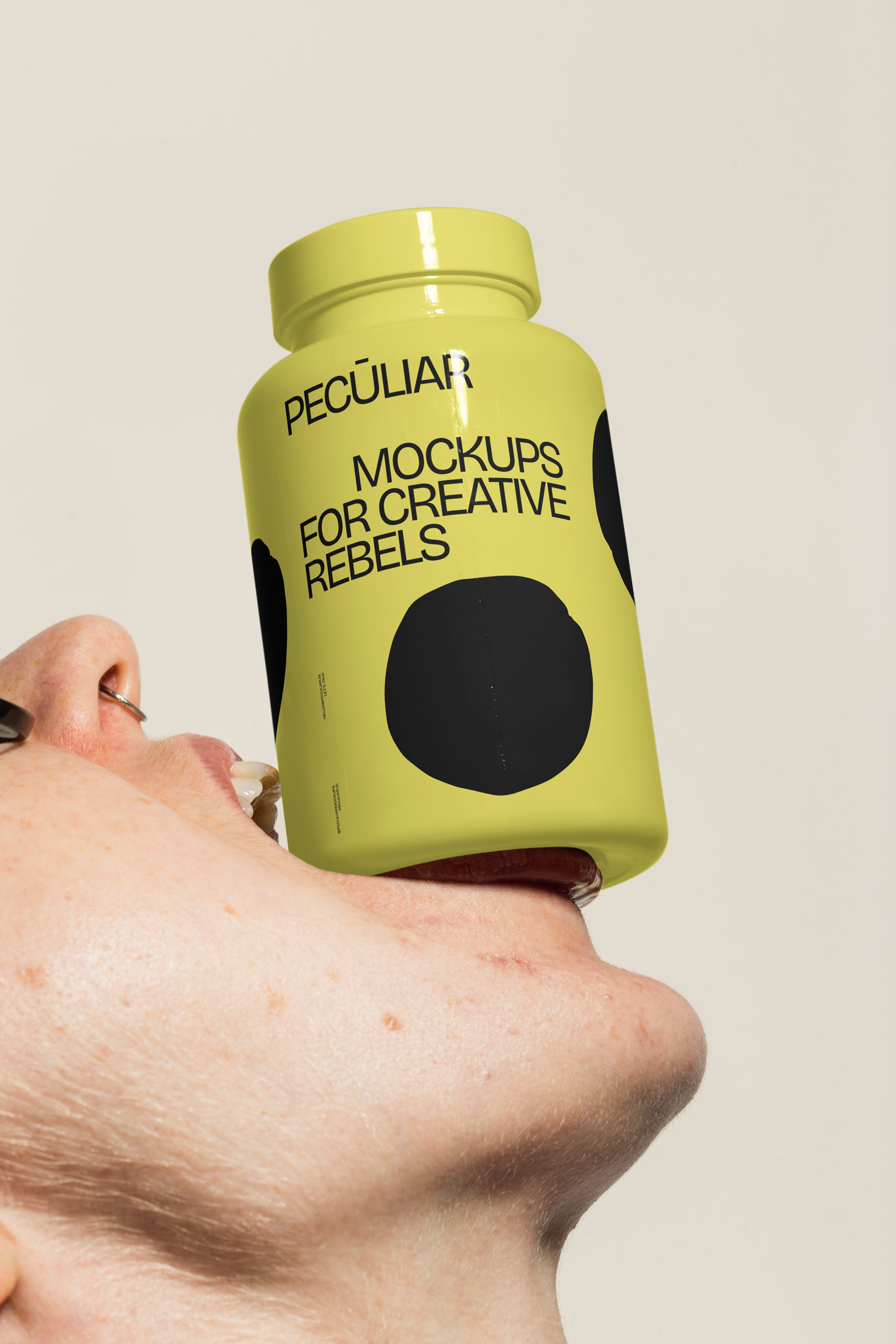 Close-up mockup of a person's face holding up a pill bottle with their mouth, in use example.